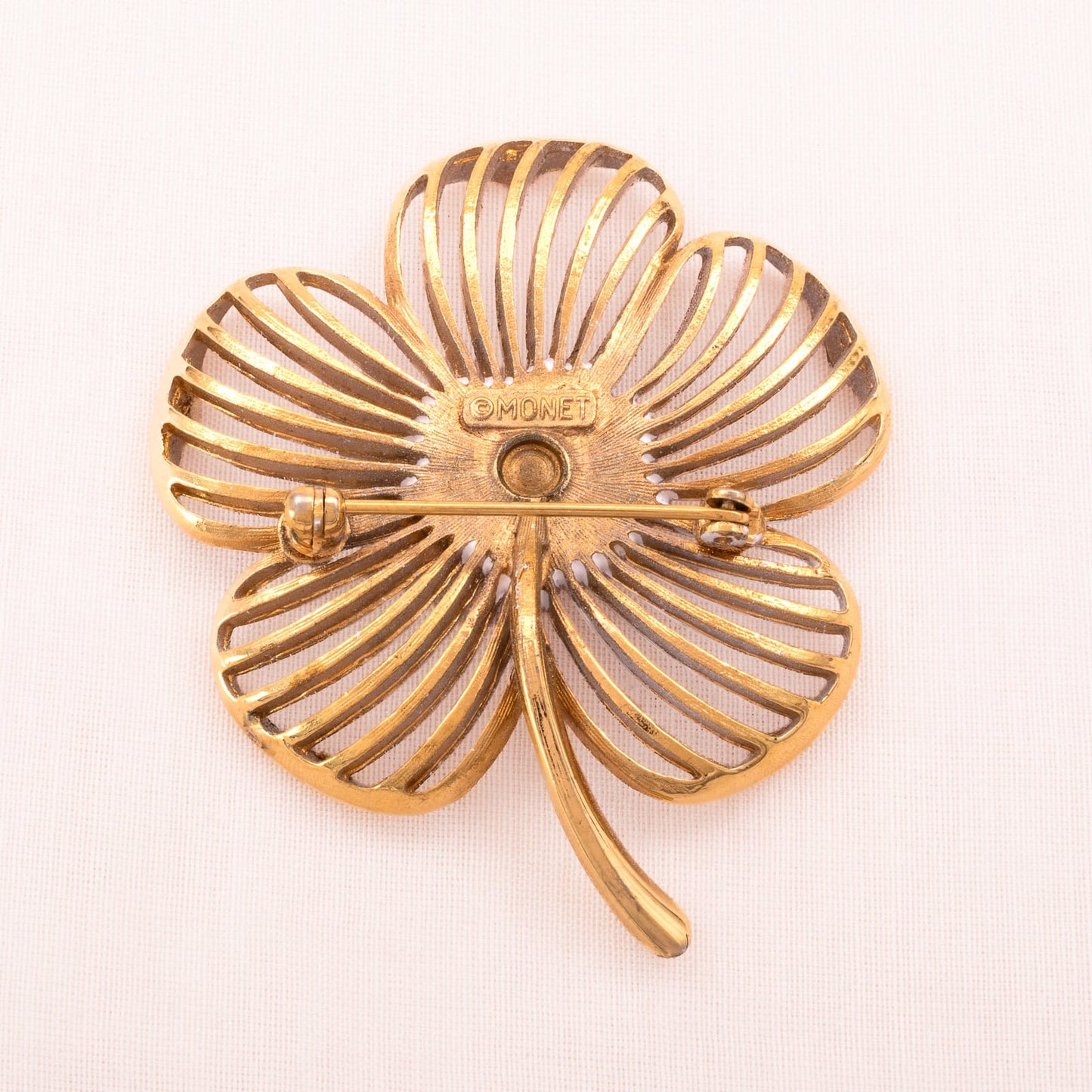 MONET white flower brooch from the 1970s