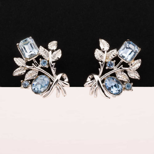 CORO silver colored flower clip earrings with blue rhinestones