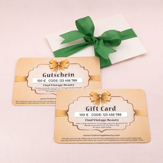 Gutschei-Gift-Card-100€-im-Umschlag-mit-grüner-Schleife
