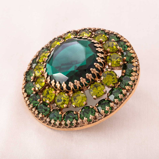 Abert-Weiss-runde-Brosche-mit-grünen-Strasssteinen