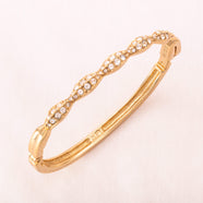 SWAROVSKI vergoldeter Armreif mit Kristallen besetzt