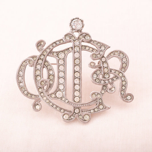 Christian-Dior-Loge-Brosche-ikonisches-Design-rhodiniert-Kristall-besetzt