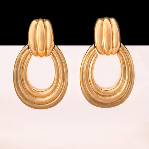 CINER chunky ear clips in a door knocker design