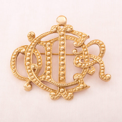 Christian DIOR logo brooch 1990s