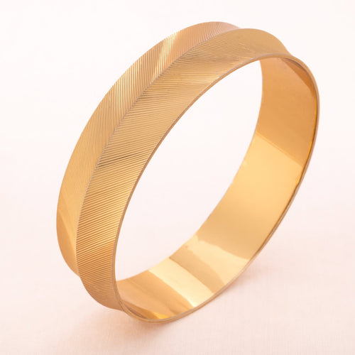 MONET iconic bangle with a polished surface