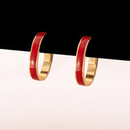 MONET Earrings gold-plated oval hoops decorated with red enamel