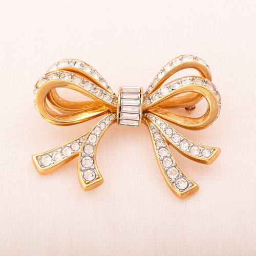 SWAROVSKI Vintage Brosche vergoldete Schleife mit Kristallen und Baguette Steinen