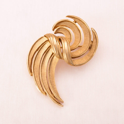 TRIFARI brooch in iconic curved design