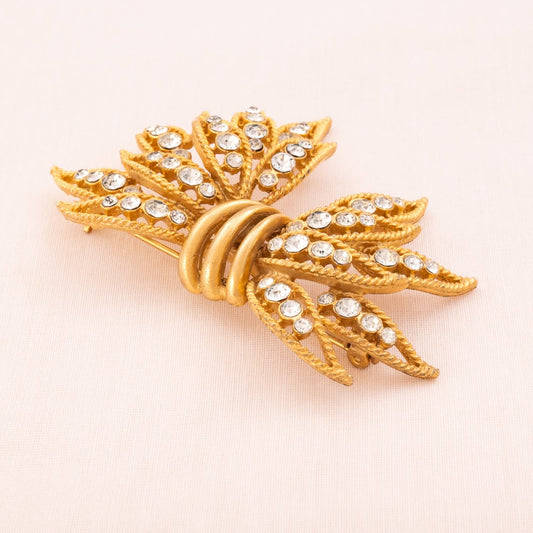 Albert-Weiss-Brosche-durchbrochene-Schleife-vergoldet-Kristall-besetzt