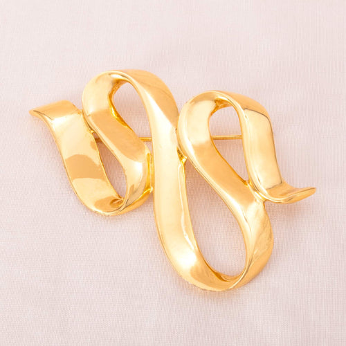 ANNE KLEIN curved gold plated brooch