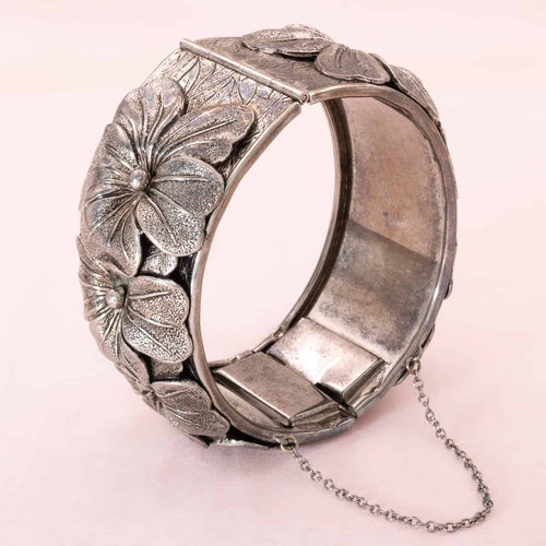 Vintage bangle with antique silver colored flower pattern