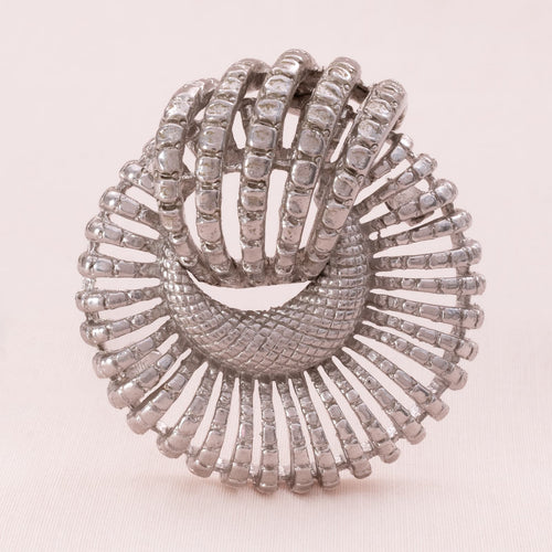 CORO round silver-colored brooch