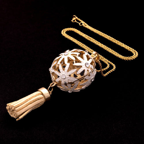 Cord necklace with white daisy ball pendant