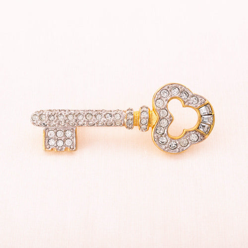 Gilded key brooch from the 1990s