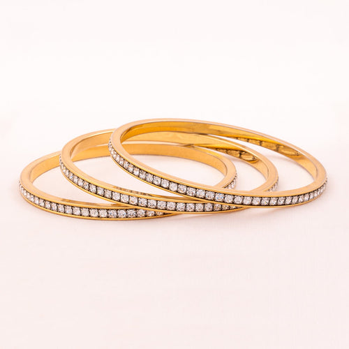 SWAROVSKI gold-plated crystal bangles in a set of 3