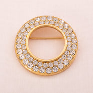 SWAROVSKI elegante Kreisbrosche mit Kristallen besetzt
