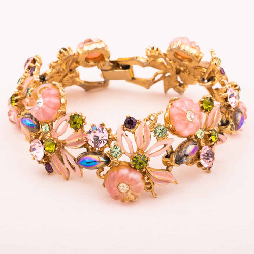 Pink enameled vintage bracelet with rhinestones and glass flowers