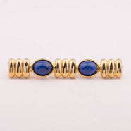 CAROLEE gold plated brooch with oval lapis lazuli
