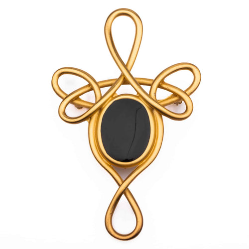 Large gold-colored brooch from the 80s