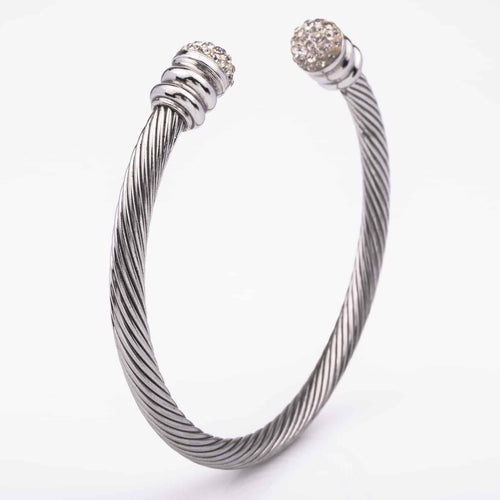 Silver colored open bangle with crystal ends