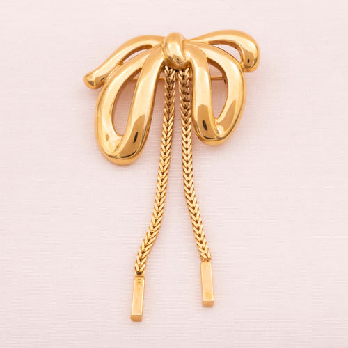 MONET gold plated bow brooch