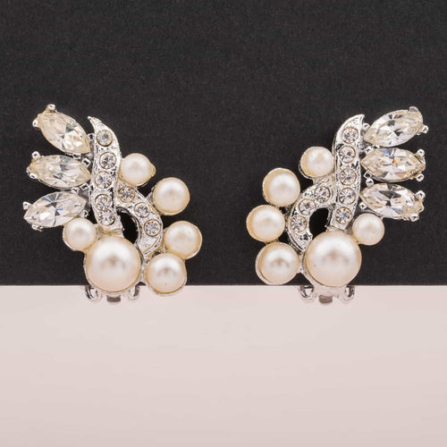 Elegant clip earrings with silver-colored crystals and pearls