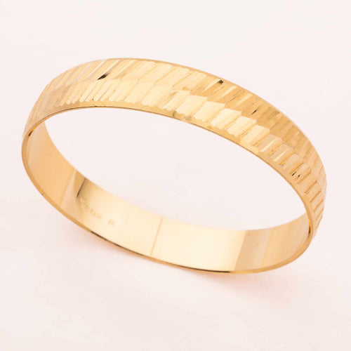 Gold plated bangle by TRIFARI from the 60s