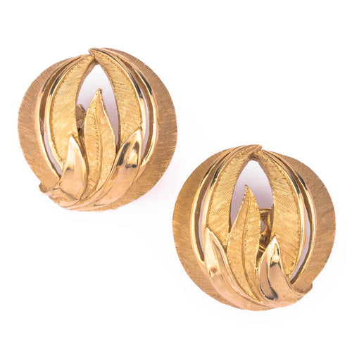 TRIFARI gold colored ear clips in the leaf design of the 60s