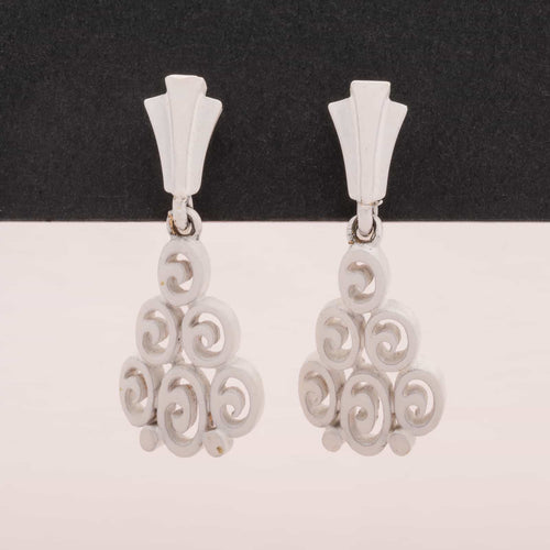 White dangle clip earrings by TRIFARI